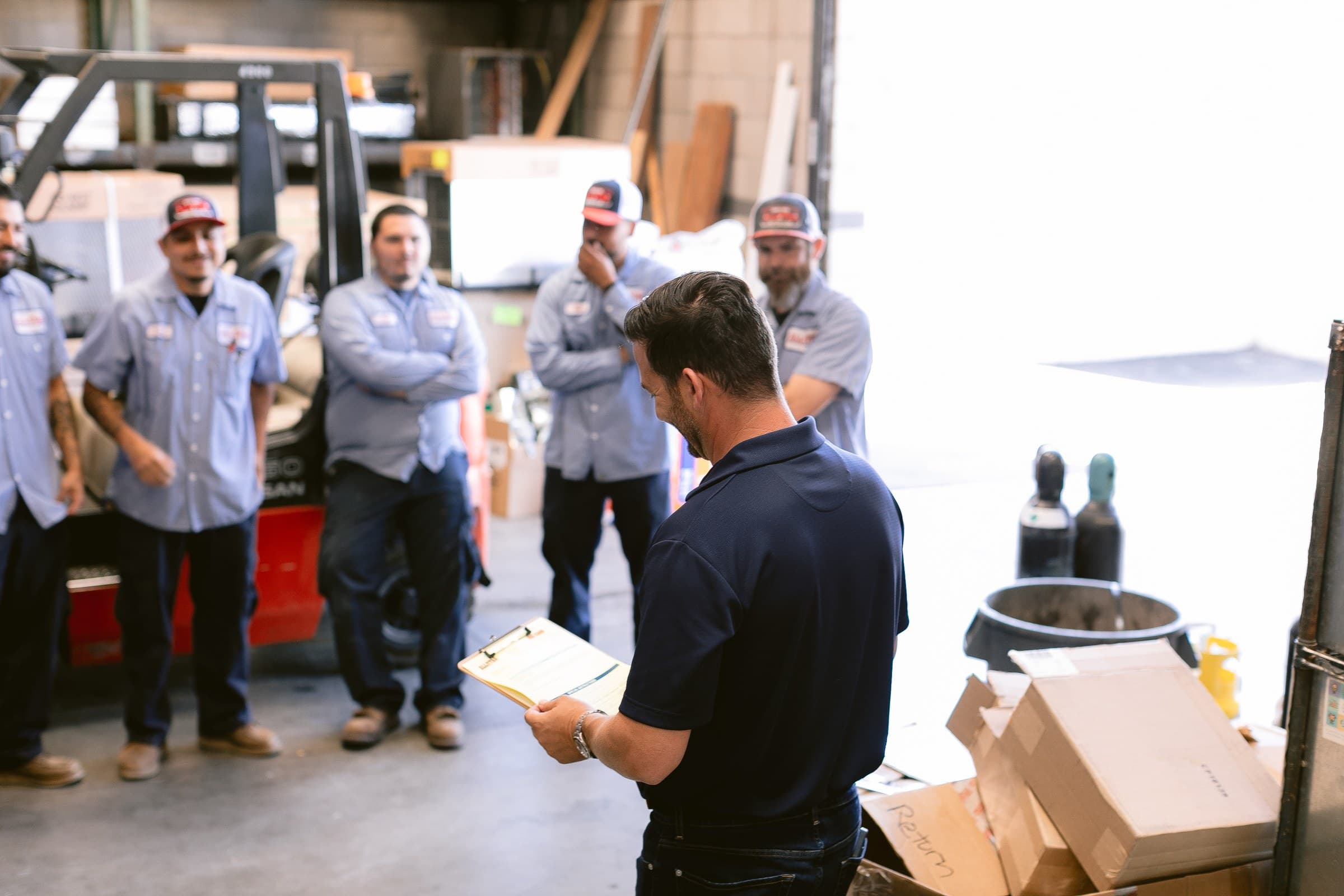 TradeBuilt Consulting — contractor team briefing on a job site